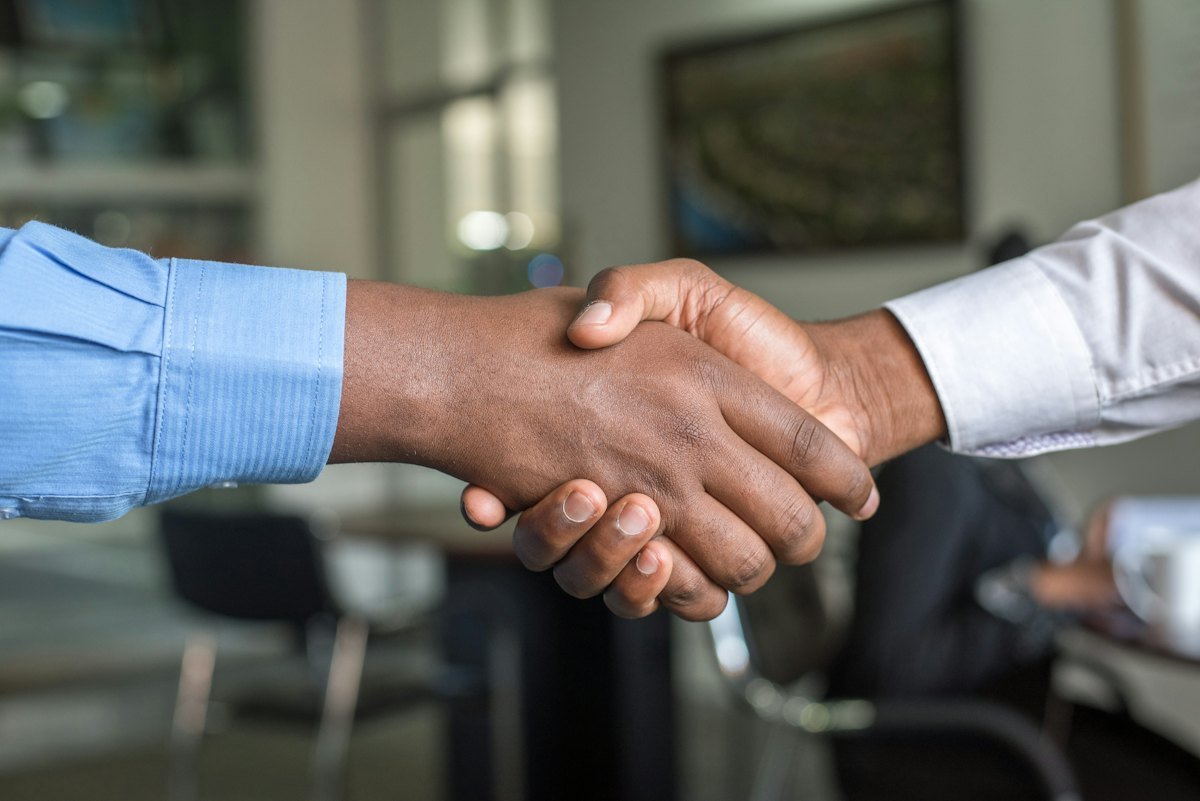 Business handshake closing a deal